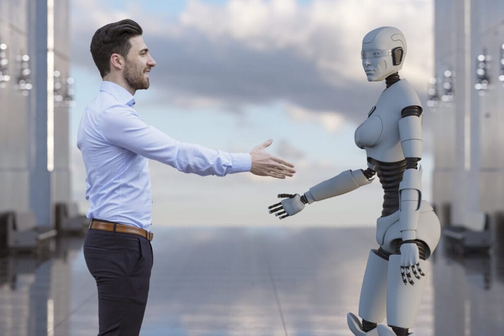  Man and robot shaking hands, representing best artificial intelligence courses.