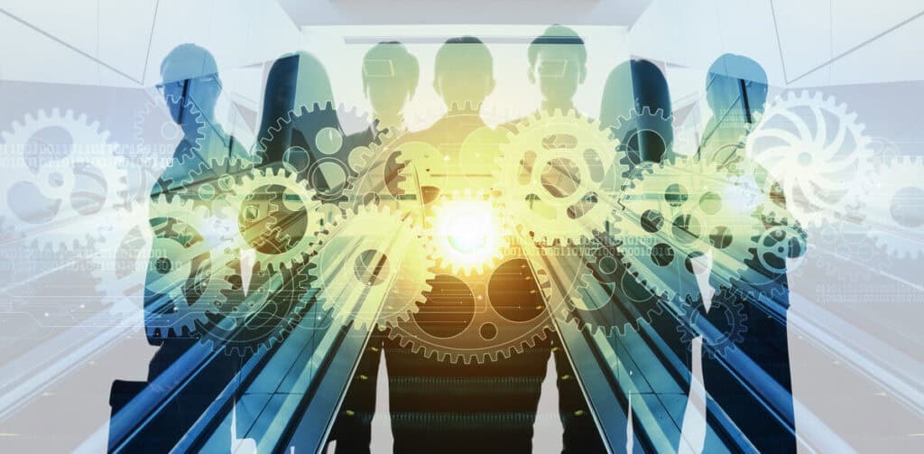  A silhouette of a BI team standing together, overlaid with interconnected gears and binary code, symbolizing collaboration and data-driven operations within Business Intelligence.