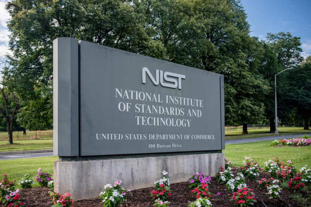 Sign for National Institute of Standards and Technology (NIST) in garden.