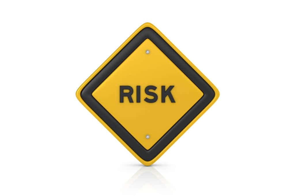 A yellow diamond-shaped road sign with the word "RISK" in bold black letters at the center. The sign has a black border and is set against a white background. This image represents common misconceptions about disaster recovery and business continuity.