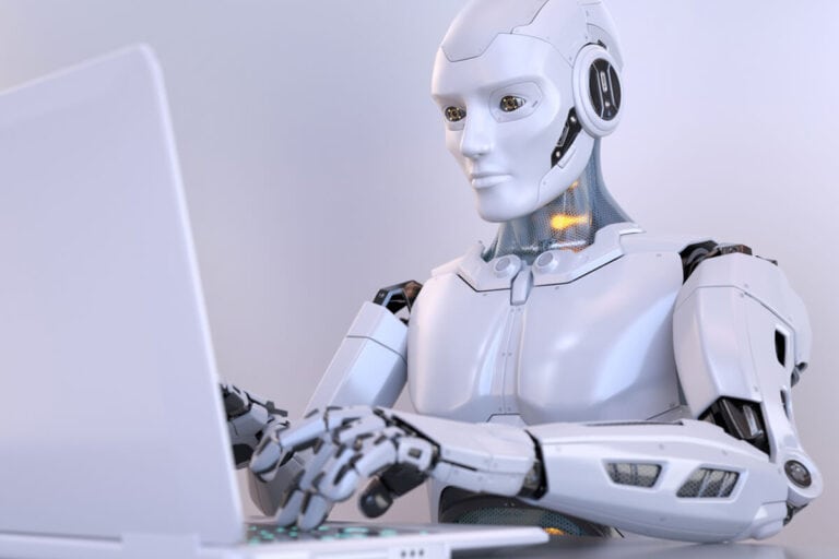 Robot typing on a laptop, representing ERP artificial intelligence.