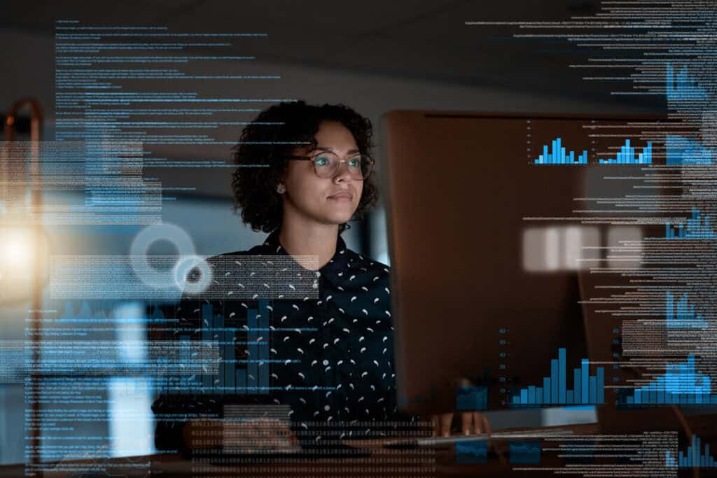 Woman analyzing data on a computer screen, representing 'Why ITSM is Important.